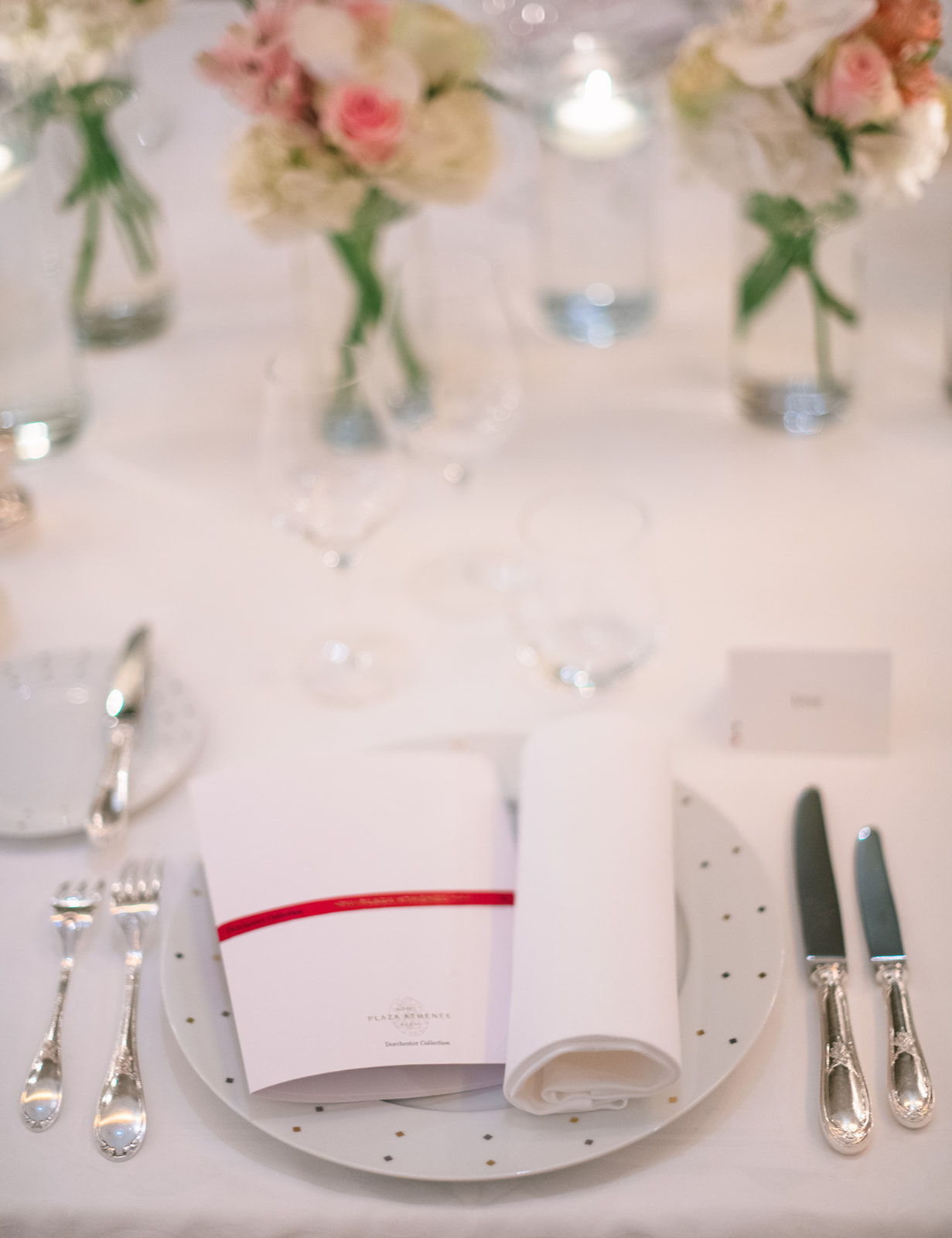 Wedding place setting with red stationery at Hôtel Plaza Athénée Paris